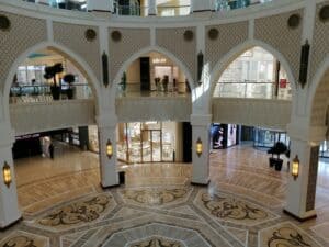 Luxurious interior view of Dubai Mall featuring stunning Arabic arches and intricate flooring design.