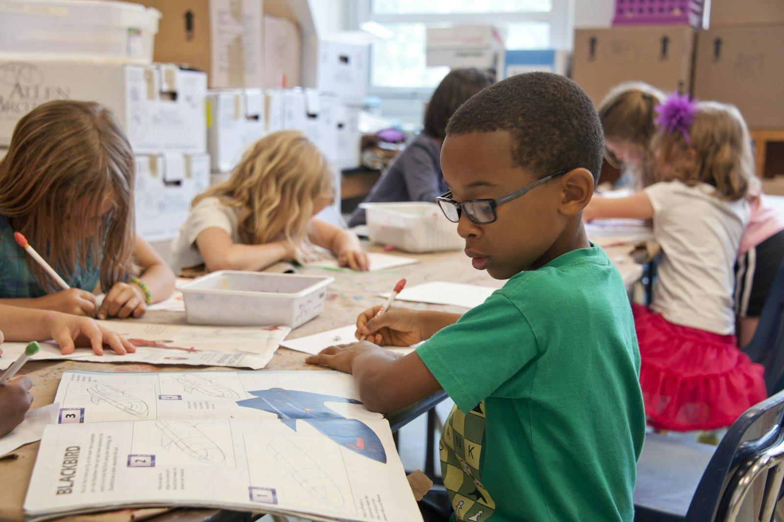 Teacher leading a classroom session with students and wellbeing posters